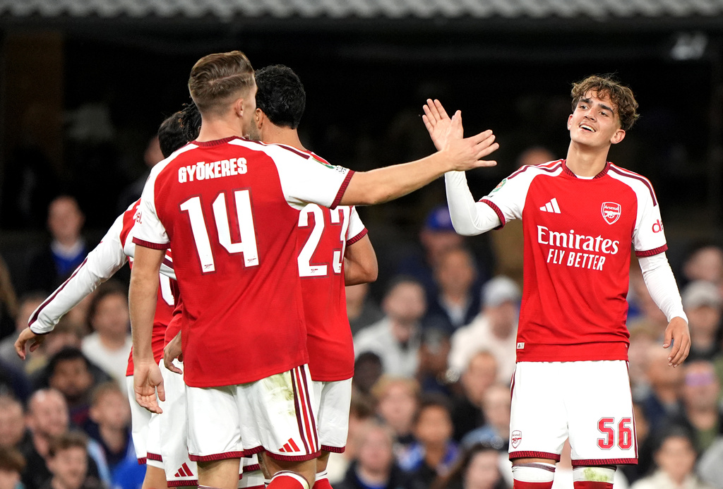 Arsenal's Max Dowman, right, celebrates scoring their side's third goal during the League Cup third round soccer match between Ipswich Town and Arsenal in Ipswich, England, Tuesday, Sept. 15, 2026. (Joe Giddens/PA via AP)