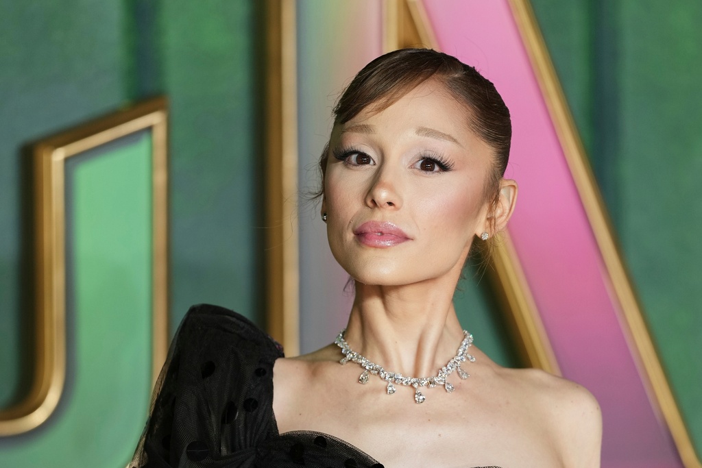 FILE - Ariana Grande poses for photographers upon arrival at the premiere of the film "Wicked For Good" in London, Nov. 10, 2025. (Photo by Scott A Garfitt/Invision/AP, File)