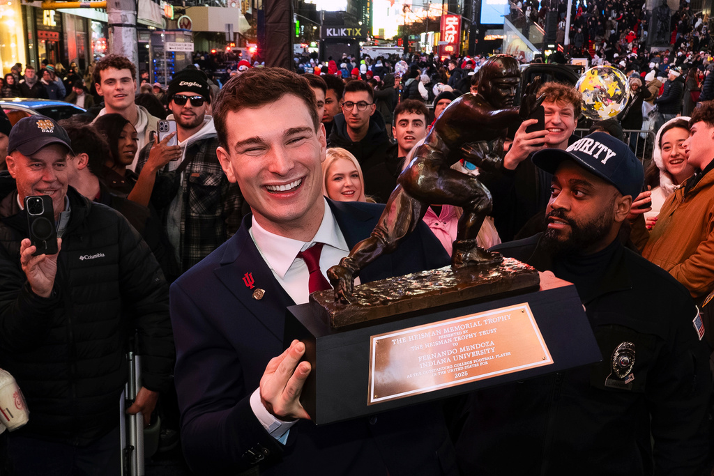 Indiana NCAA college football quarterback Fernando Mendoza celebrates in Times Square after winning the Heisman Trophy in New York, Saturday, Dec. 13, 2025. (Todd Van Emst/Pool Photo via AP)