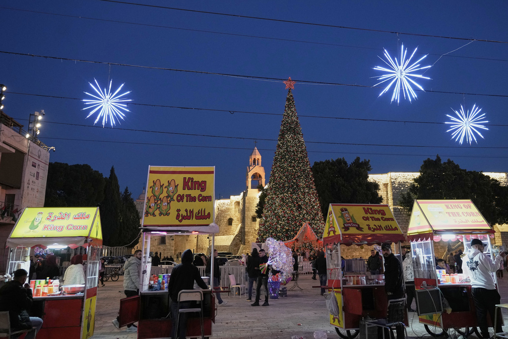 Palestinian vendors wait for clients in Manger Square in the West Bank city of Bethlehem, Tuesday, Dec. 16, 2025. (AP Photo/Mahmoud Illean)
