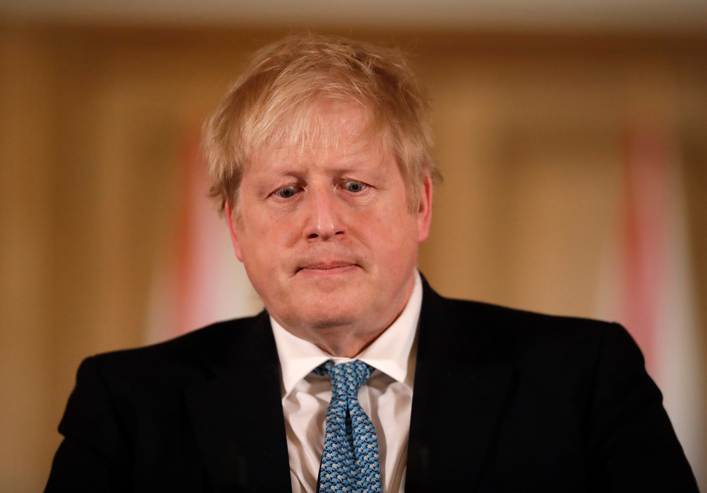 FILE - In this March 17, 2020 file photo British Prime Minister Boris Johnson gives a news conference about the ongoing situation with the COVID-19 coronavirus outbreak inside 10 Downing Street in London. (AP Photo/Matt Dunham, Pool)