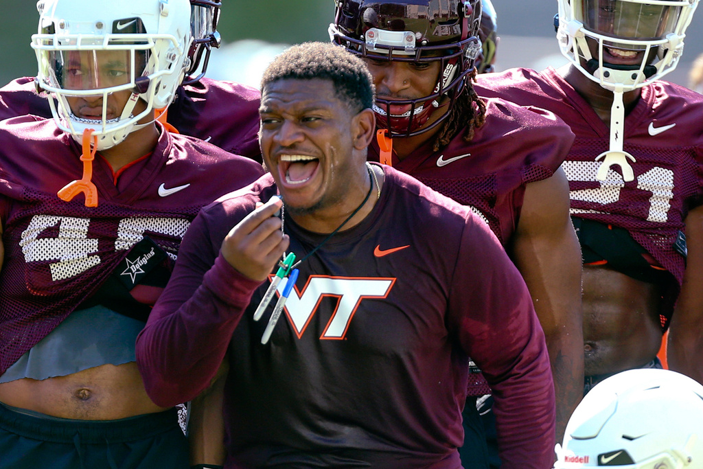 Virginia Tech defensive coordinator/linebackers coach Chris Marve speaks to players during the NCAA college football team's practice in Blacksburg, Va., Wednesday, Aug. 3, 2022. (Matt Gentry/The Roanoke Times via AP, File)