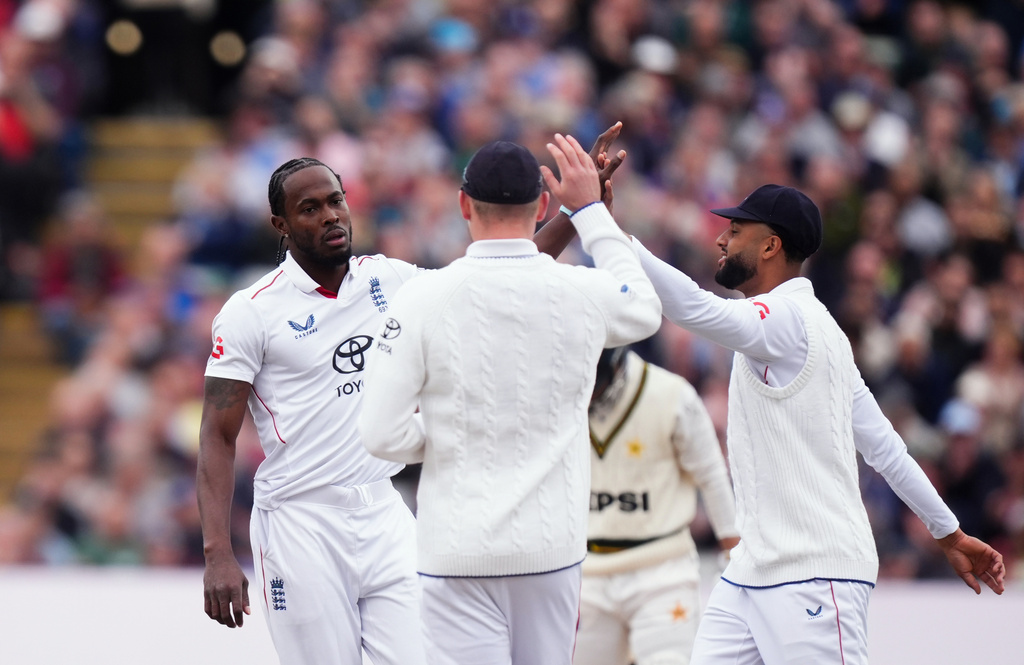 England's Jofra Archer, left, celebrates the wicket of Pakistan's Azan Awais, during day one of the third cricket test match between England and Pakistan, at Edgbaston, in Birmingham, England, Wednesday, Sept. 9, 2026. (Mike Egerton/PA via AP)
