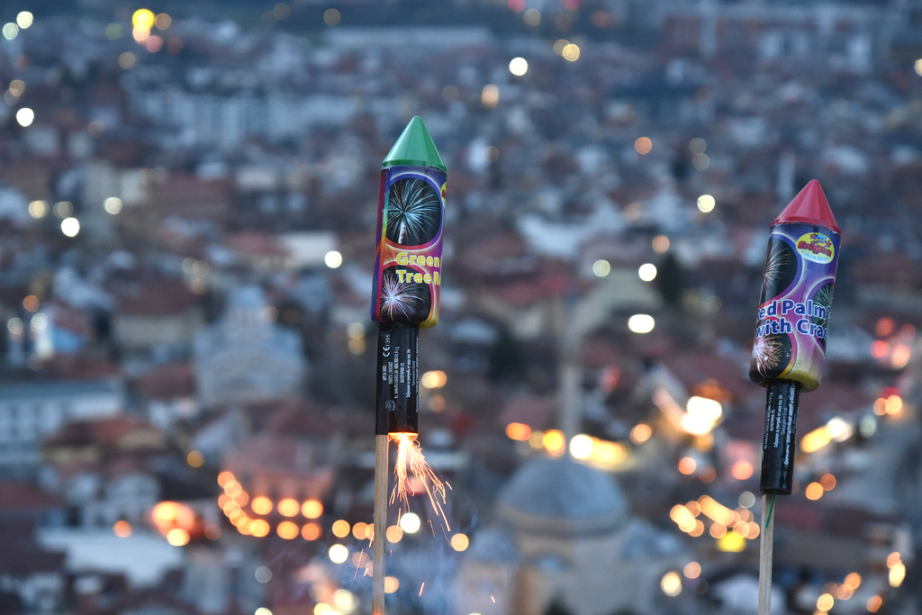 Keeping alive an old Ramadan tradition dating back to the centuries of Ottoman rule, fireworks are lit signaling the end of the daily fast in Prizren, Kosovo, Thursday, Feb. 19, 2026. (AP Photo/Laura Hasani)