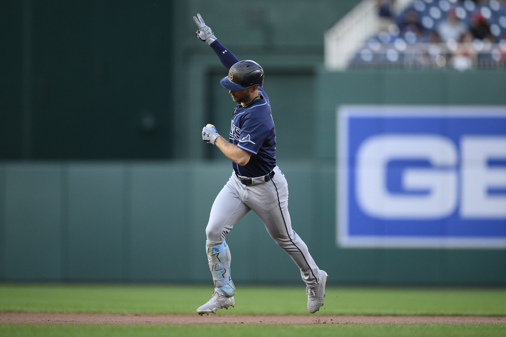Tampa Bay Rays' Brandon Lowe gestures as he celebrates his two-home run while rounding the bases in the first inning of a baseball game against the Washington Nationals, Friday, Aug. 29, 2025, in Washington. (AP Photo/Nick Wass)