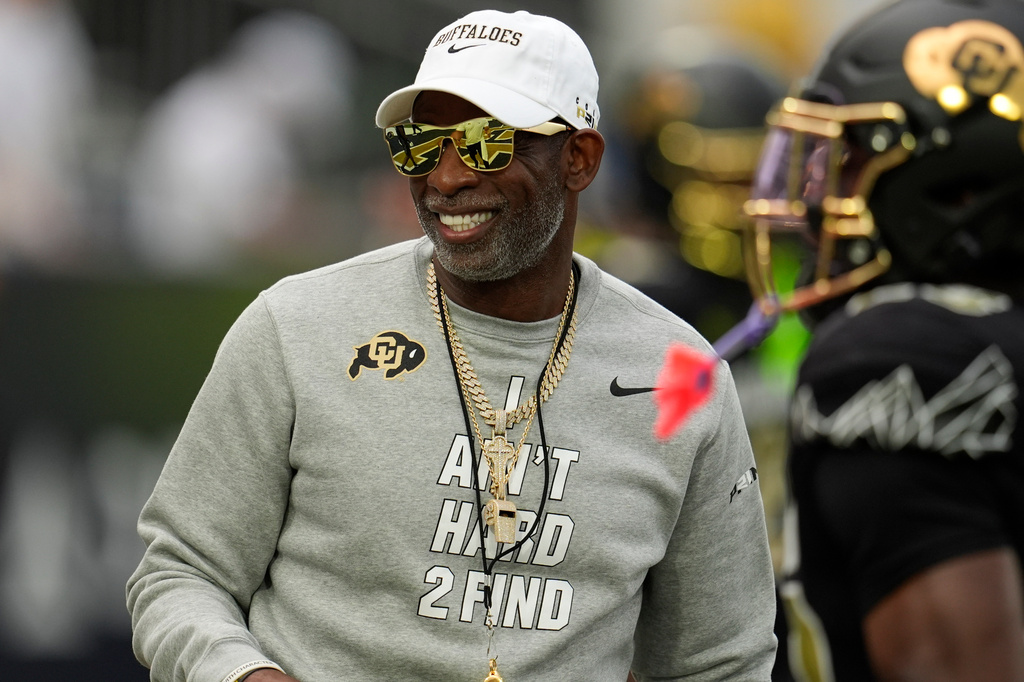 Colorado head coach Deion Sanders walks on the field before an NCAA college football game between Georgia Tech and Colorado, Thursday, Sept. 3, 2026, in Atlanta. (AP Photo/Mike Stewart)