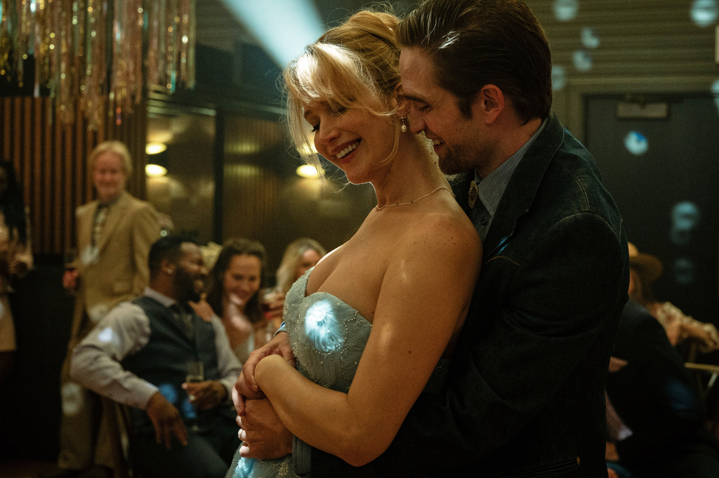 This image released by Mubi shows Jennifer Lawrence, left, and Robert Pattinson in a scene from "Die My Love." (Kimberly French/Mubi via AP)