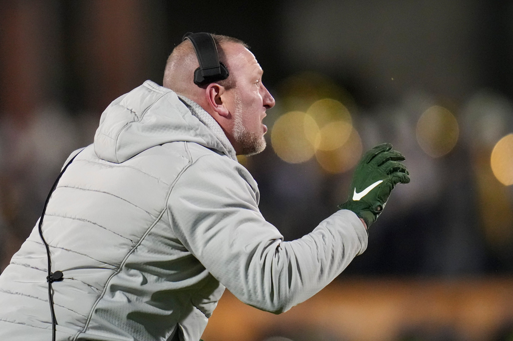 FILE - North Dakota State head coach Tim Polasek talks to his team during the first half of the FCS Championship NCAA college football game against Montana State, Jan. 6, 2025, in Frisco, Texas. (AP Photo/Julio Cortez, File)