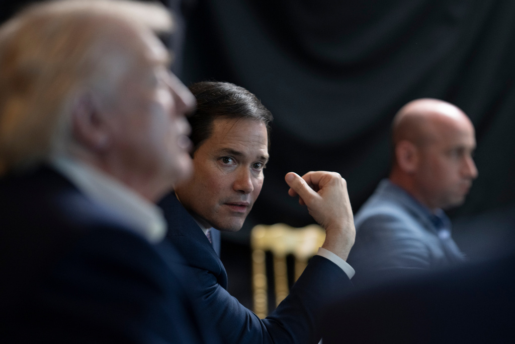 In this photo released by the White House, President Donald Trump monitors U.S. military operations in Venezuela, with Secretary of State Marco Rubio and White House deputy chief of staff Stephen Miller at Mar-a-Lago in Palm Beach, Fla., Saturday, Jan. 3, 2026. (Molly Riley/The White House via AP)