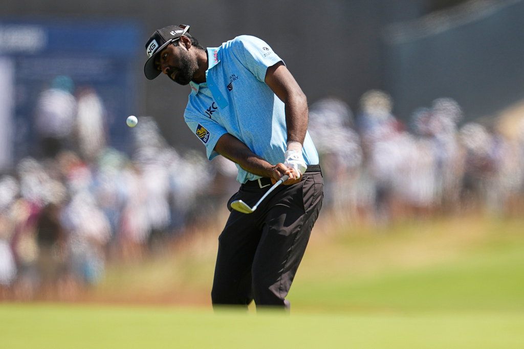 Sahith Theegala chips to the green on the second hole during the final round of the U.S. Open golf tournament at Shinnecock Hills Golf Club in Southampton, N.Y., Sunday, June 21, 2026. (AP Photo/George Walker IV)