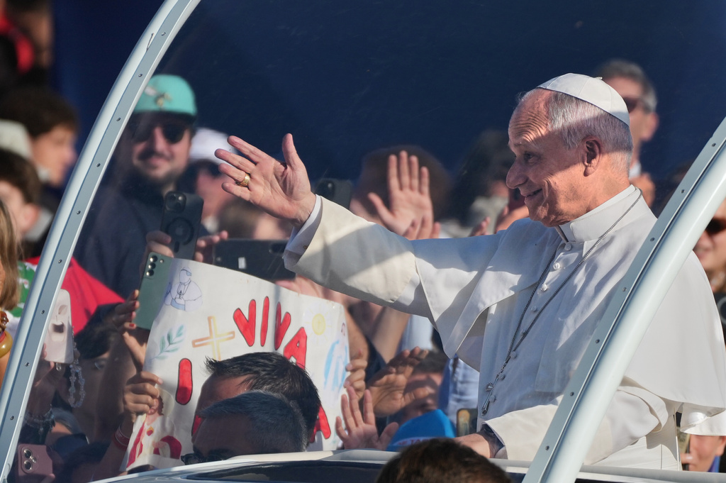 Pope Leo XIV arrives on the popemobile to celebrate Mass at the Sanctuary of Our Lady of Lourdes, Sunday, Sept. 27, 2026, in Lourdes, France. (AP Photo/Gregorio Borgia)