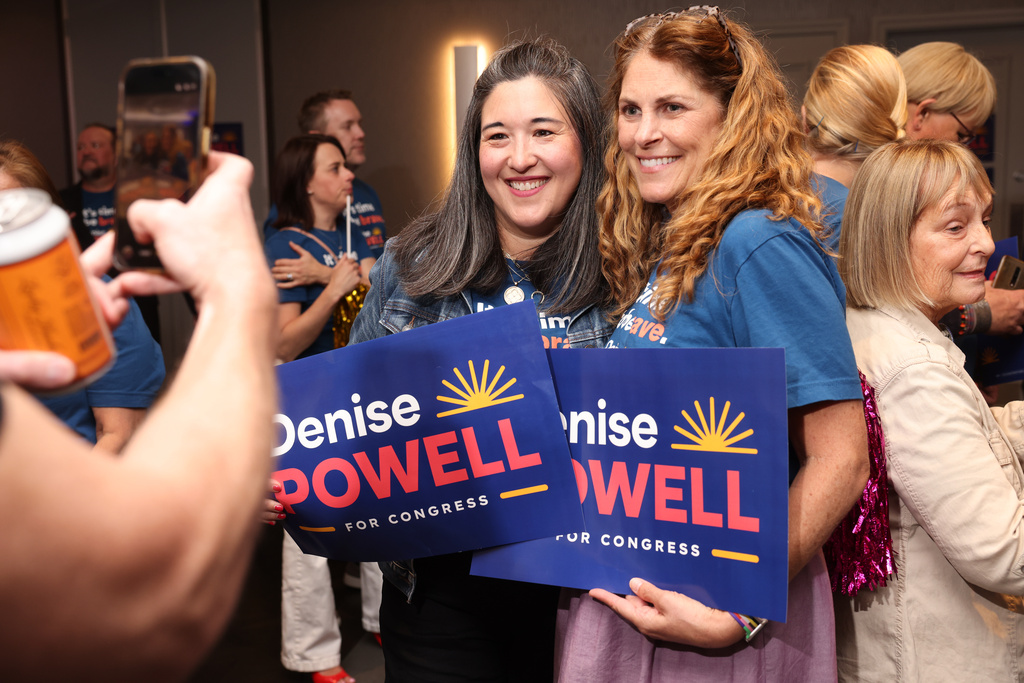Supporters Shannon Gilroy, left, and Emily Moody pose for a photo during an election night watch party for Denise Powell, candidate for the Democratic nomination to the House of Representatives in Nebraska's second district, Tuesday, May 12, 2026, in Omaha, Neb. (AP Photo/Rebecca S. Gratz)