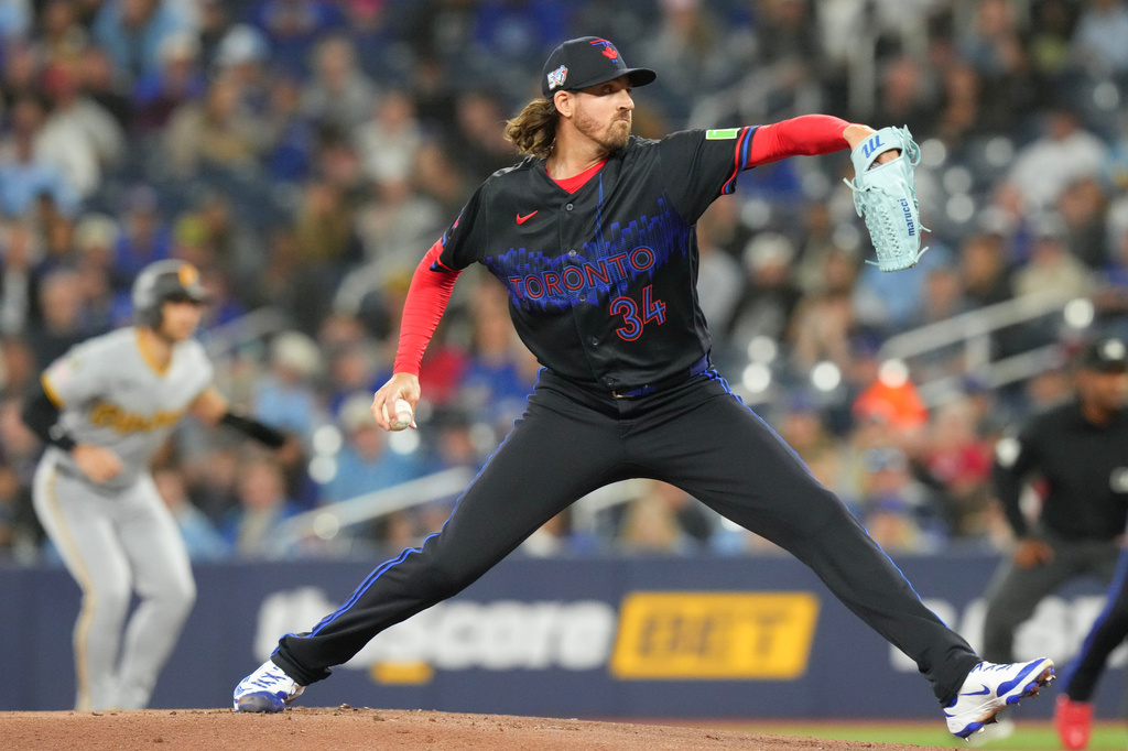 Toronto Blue Jays pitcher Kevin Gausman (34) works against the Pittsburgh Pirates during first inning of a baseball game in Toronto, Friday, May 22, 2026. (Chris Young/The Canadian Press via AP)