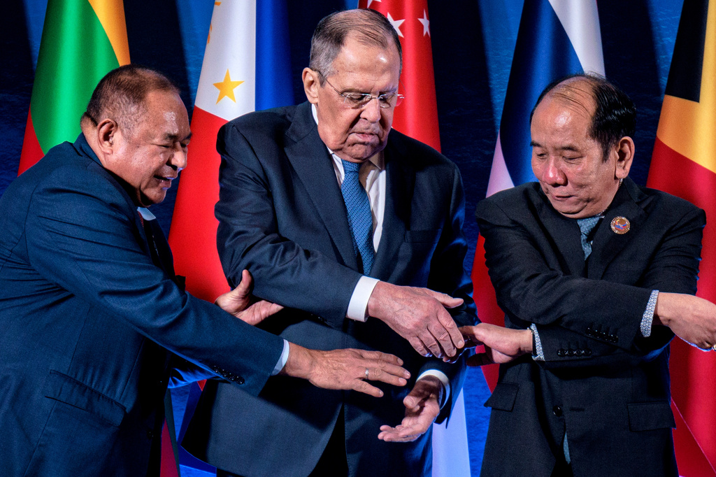 From left, East Timor's Foreign Minister Bendito dos Santos Freitas, Russian Foreign Minister Sergey Lavrov and Myanmar Permanent Secretary of the Ministry of Foreign Affairs Hau Khan Sum link hands as they pose for a group photo during the ASEAN Post-Ministerial Conference with Russia on the sidelines of the Association of Southeast Asian Nations (ASEAN) Foreign Ministers' Meeting in Pasay city, Metro Manila, Philippines Wednesday, July 22, 2026. (Ezra Acayan/Pool Photo via AP)