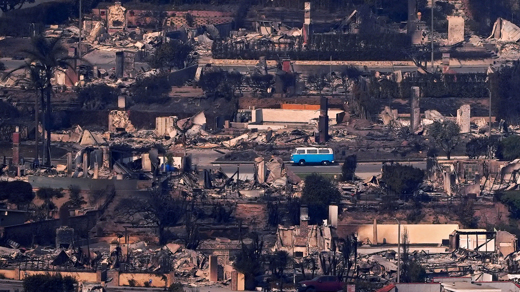 FILE - A VW bus sits among burned out homes, Thursday, Jan. 9, 2025, in Malibu, Calif. (AP Photo/Mark J. Terrill, File)