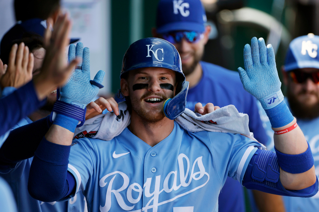 Kansas City Royals' Bobby Witt Jr. celebrates in the dugout after hitting a home run during the first inning of a baseball game against the Athletics in Kansas City, Mo., Thursday, Aug. 20, 2026. (AP Photo/Colin E. Braley)