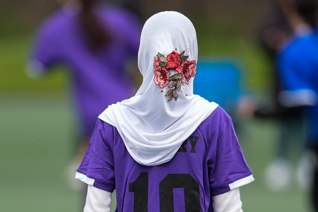 Suraya Abdull plays in a soccer tournament for immigrant and refugee girls on Sunday, March 29, 2026, in Portland, Ore. (AP Photo/Jenny Kane)