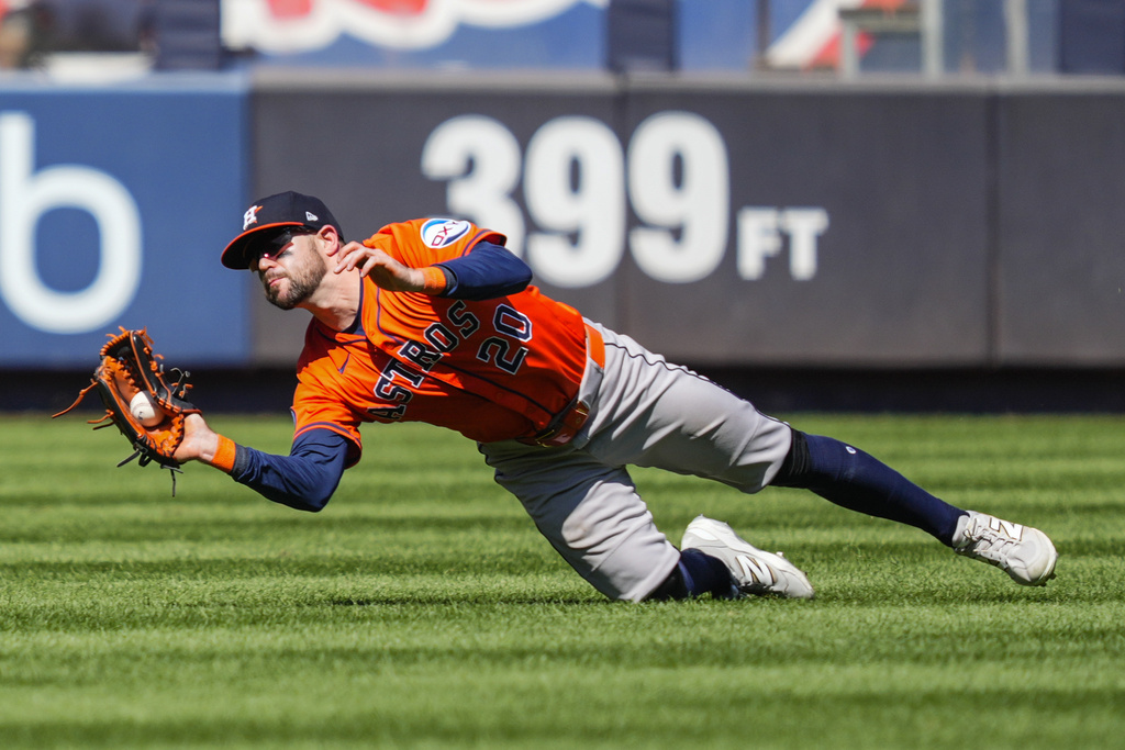 Houston Astros outfielder Chas McCormick catches a fly ball by New York Yankees' Ryan McMahon during the fourth inning of a baseball game against the New York Yankees, Saturday, Aug. 9, 2025, in New York. (AP Photo/Yuki Iwamura)