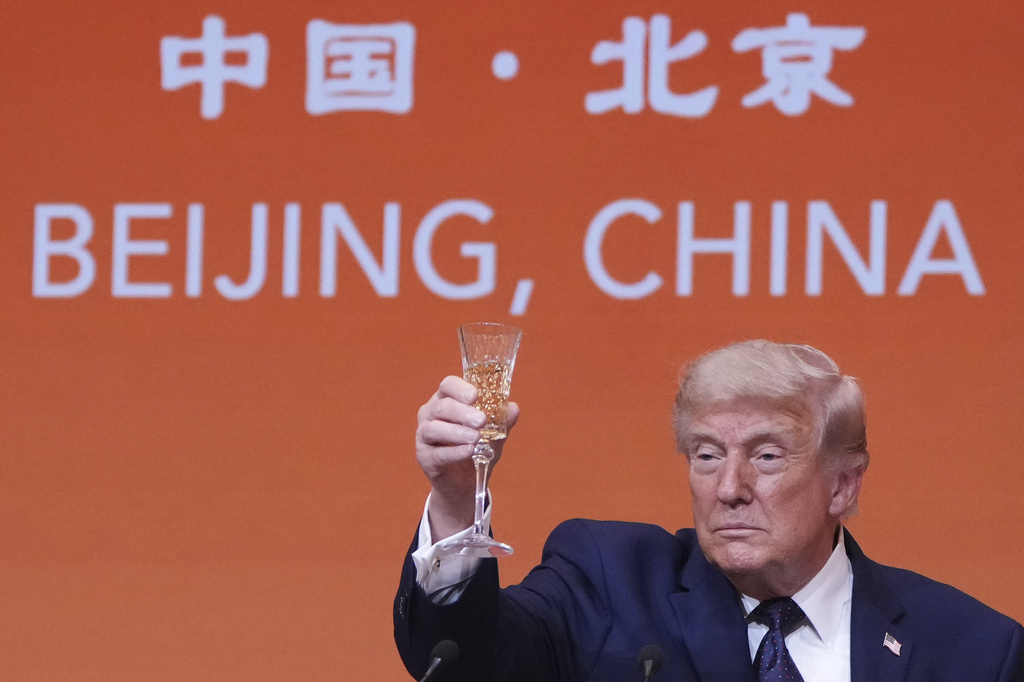 President Donald Trump proposes a toast during a state dinner with China's President Xi Jinping at the Great Hall of the People on Thursday May 14, 2026, in Beijing. (AP Photo/Mark Schiefelbein)