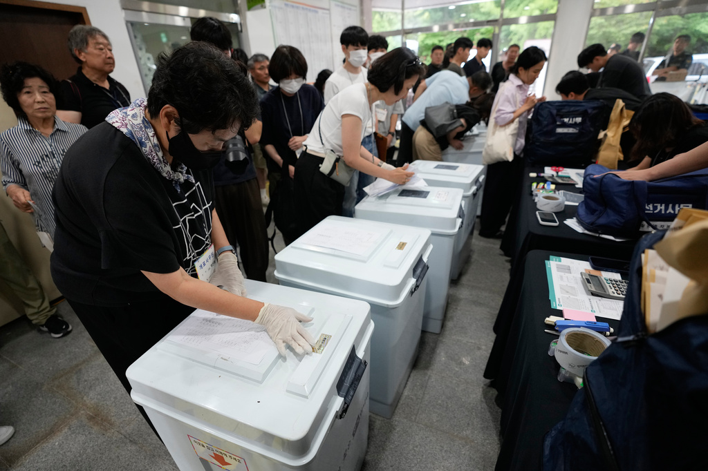 South Korean National Election Commission officials check boxes containing ballots for the local elections at a gymnasium in Seoul, South Korea, Wednesday, June 3, 2026. (AP Photo/Ahn Young-joon)