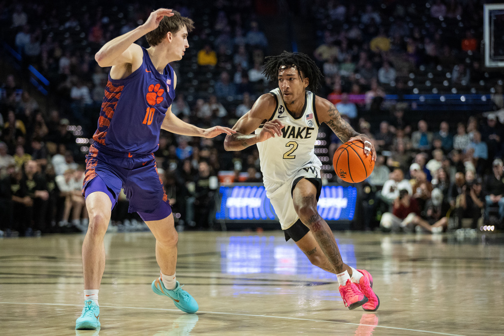 Wake Forest forward Juke Harris (2) drives to the basket against Clemson forward Jake Wahlin (10) during the first half of an NCAA college basketball game Wednesday, Feb. 18, 2026, in Winston-Salem, N.C. (AP Photo/Scott Kinser)
