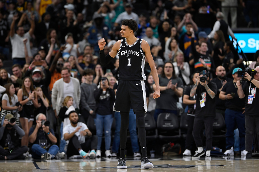 FILE - San Antonio Spurs forward Victor Wembanyama celebrates a basket late in the second half of an NBA basketball game against the Golden State Warriors, Saturday, Nov. 23, 2024, in San Antonio. San Antonio won 104-94. (AP Photo/Darren Abate, File)