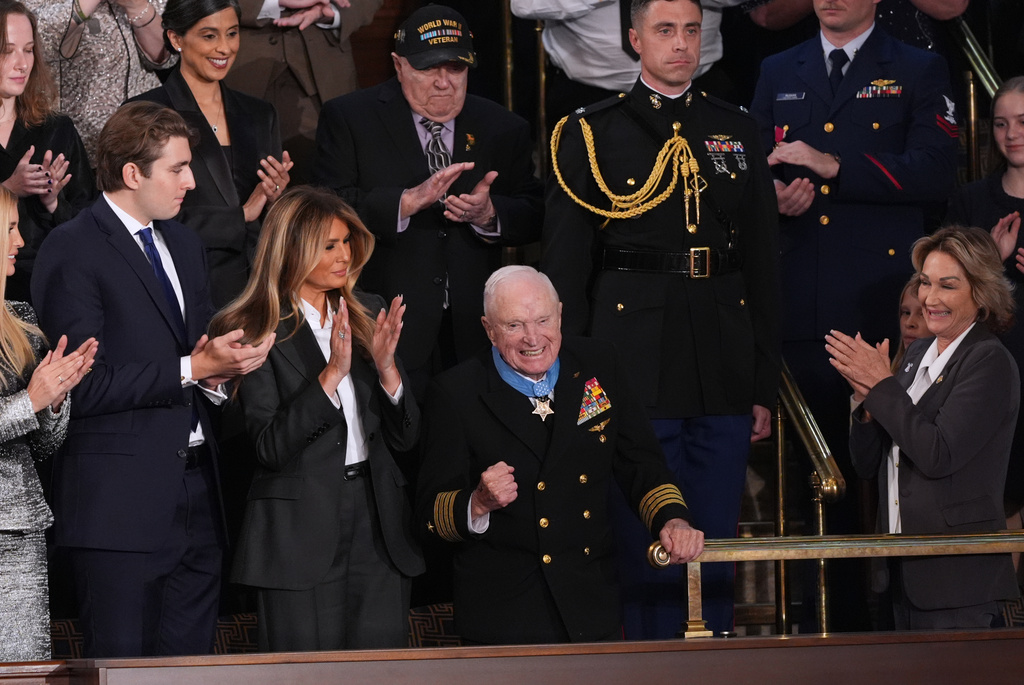 First lady Melania Trump applauds after presenting the Congressional Medal of Honor to World War II Navy Pilot Capt. Royce Williams during President Donald Trump's State of the Union address to a joint session of Congress in the House chamber at the U.S. Capitol in Washington, Tuesday, Feb. 24, 2026.(AP Photo/J. Scott Applewhite)