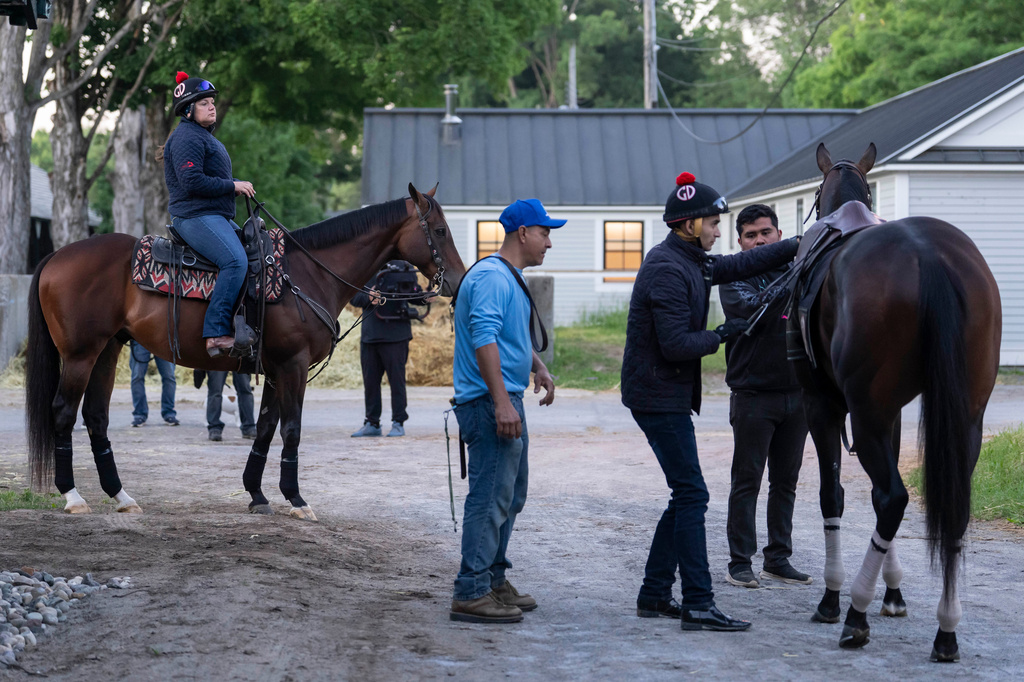 Trainer Cherie DeVaux watches Kentucky Derby winner and Belmont Stakes entrant Golden Tempo ahead of the 158th running of the Belmont Stakes horse race at Saratoga Race Course, Thursday, June 4, 2026, in Saratoga Springs, N.Y. (AP Photo/Yuki Iwamura)