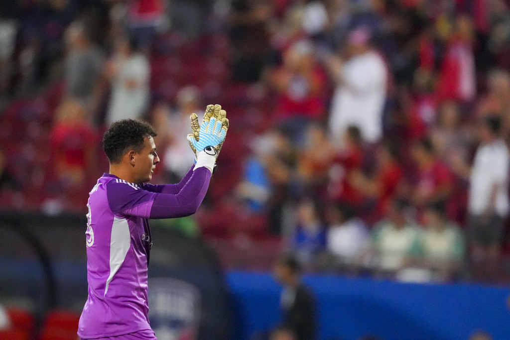 FC Dallas goalkeeper Jacob Jackson reacts after teammate Petar Musa scored a goal against Austin FC during the first half of an MLS soccer match Saturday, Sept. 13, 2025, in Frisco, Texas. (AP Photo/Julio Cortez)