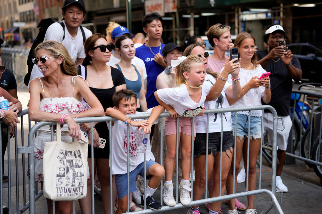 Fans gather outside Madison Square Garden ahead of a reported wedding between Taylor Swift and Travis Kelce on Friday, July 3, 2026, in New York. (Photo by Charles Sykes/Invision/AP)