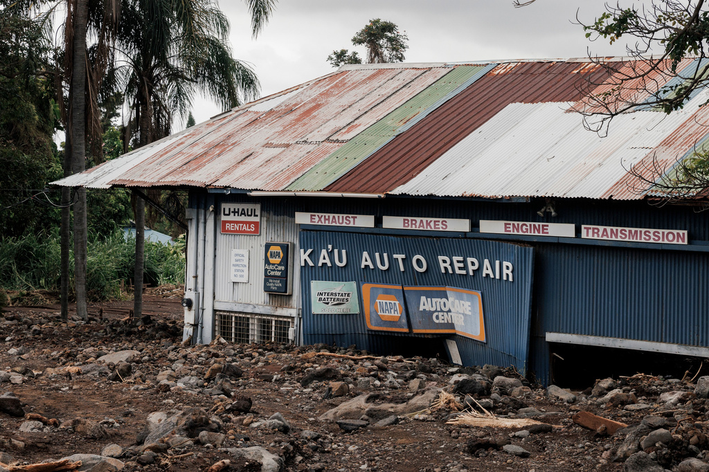 Ka'u Auto Repair Shop is seen surrounded by a field of debris after Hurricane Lala in Naalehu, Hawaii, Monday, Aug. 17, 2026. (Stephen Lam/San Francisco Chronicle via AP)