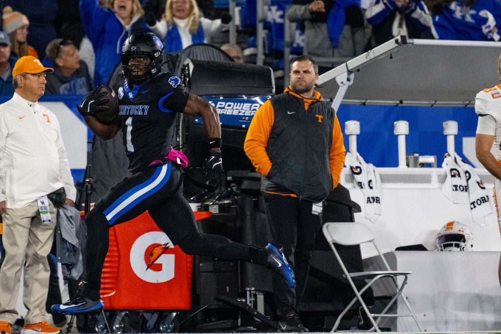 Kentucky wide receiver Kendrick Law (1) runs the ball in for a touchdown in the first quarter of an NCAA college football game against Tennessee, Saturday, Oct. 25, 2025, in Lexington, Ky. (AP Photo/Michael Swensen)