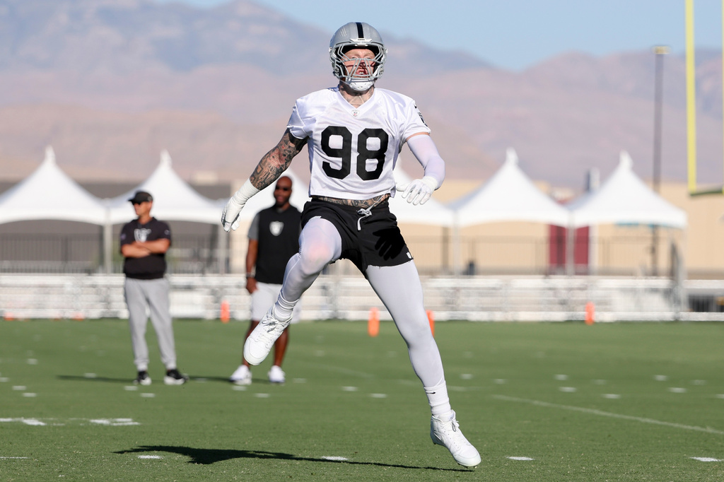 Las Vegas Raiders defensive end Maxx Crosby (98) warms up during practice at the team's NFL football training camp, Thursday, July 30, 2026, in Henderson, Nev. (AP Photo/Ian Maule)