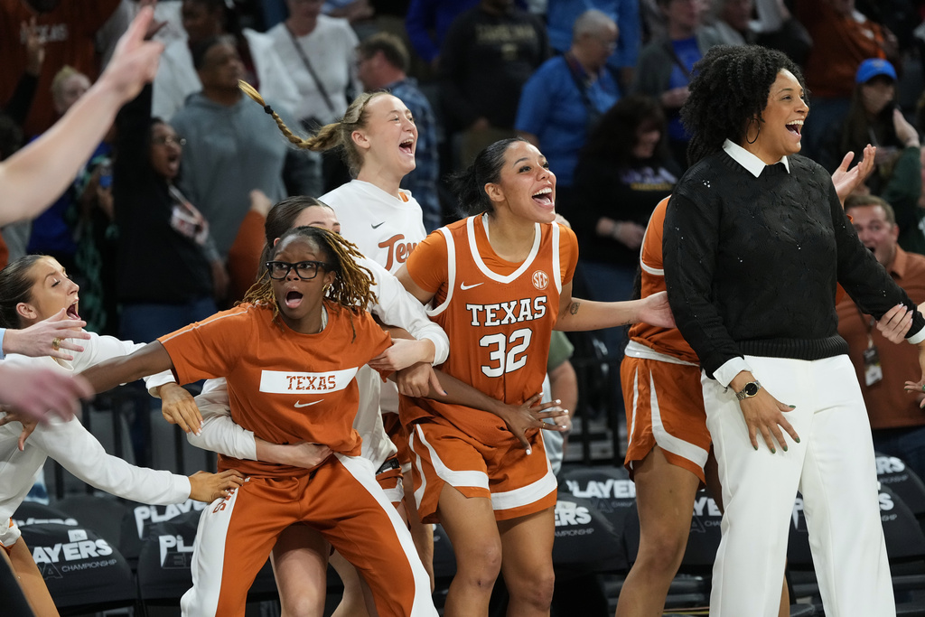 Texas players celebrate as they defeat South Carolina in an NCAA college basketball game in the Players Era tournament in Las Vegas, Thursday, Nov. 27, 2025. (AP Photo/Eric Gay)
