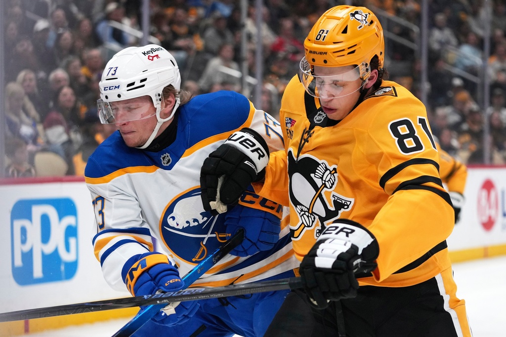 Buffalo Sabres Zach Metsa (73) goes into the corner defending Pittsburgh Penguins Ben Kindel during the second period of an NHL hockey game in Pittsburgh, Thursday, March 5, 2026. (AP Photo/Gene J. Puskar)