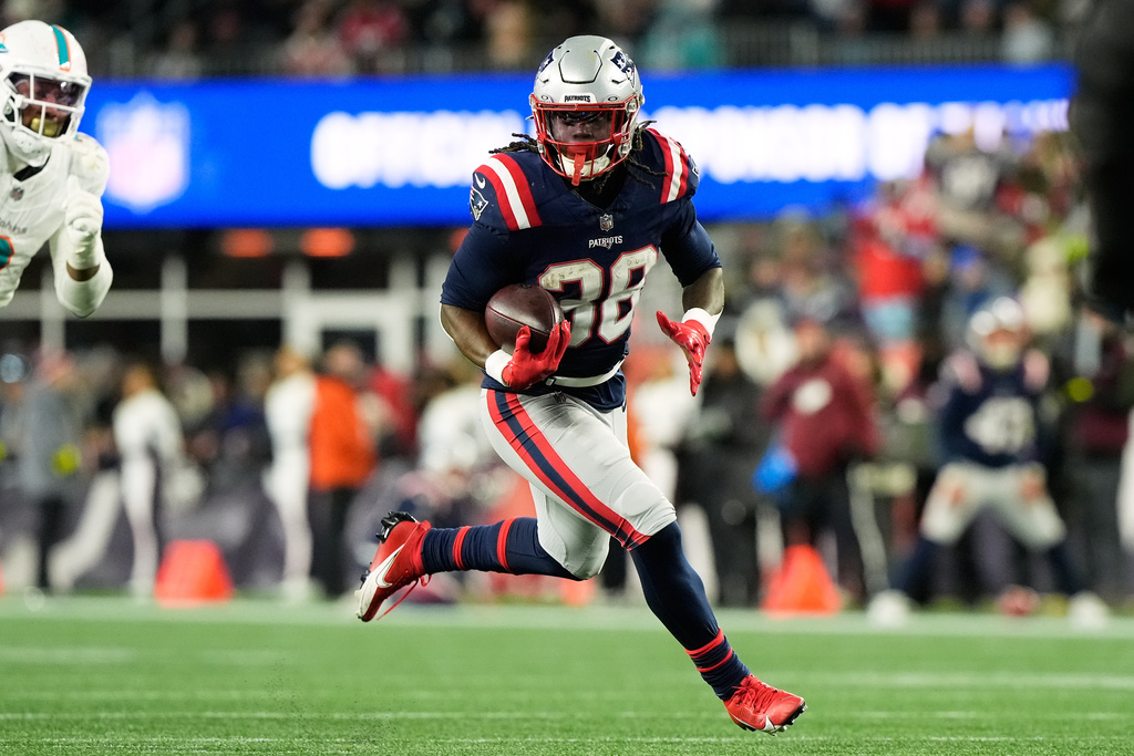 New England Patriots running back Rhamondre Stevenson runs for a touchdown during the second half of an NFL football game against the Miami Dolphins in Foxborough, Mass., Sunday, Jan. 4, 2026. (AP Photo/Robert F. Bukaty)