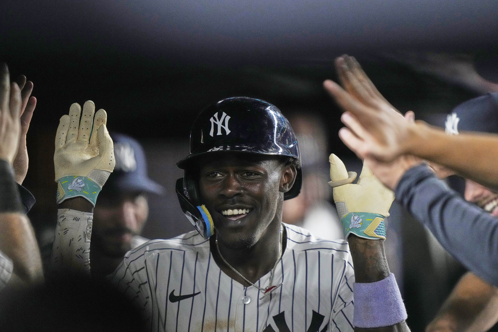 New York Yankees' Jazz Chisholm Jr. celebrates with teammates after hitting a home run during the eighth inning of a baseball game against the Minnesota Twins Monday, Aug. 11, 2025, in New York. (AP Photo/Frank Franklin II)
