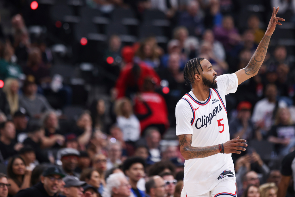 Los Angeles Clippers forward Derrick Jones Jr. gestures after making a 3-point basket during the first half of an NBA basketball game against the New Orleans Pelicans, Sunday, March 1, 2026, in Inglewood, Calif. (AP Photo/Jessie Alcheh)