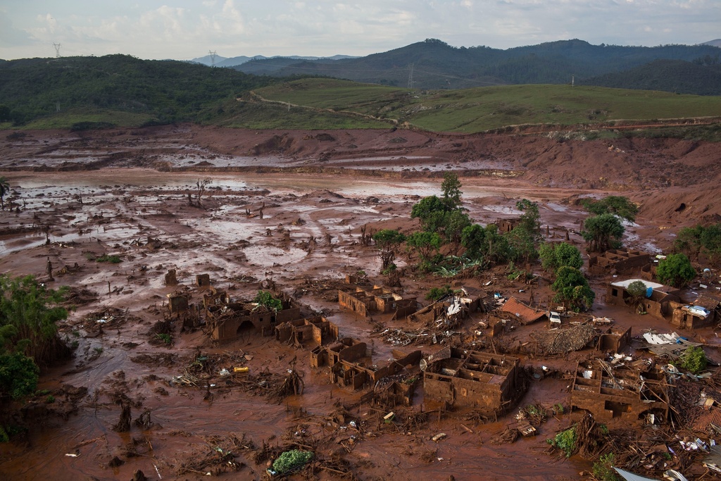 FILE - Debris is visible after a dam burst at the small town of Bento Rodrigues in Minas Gerais state, Brazil, Nov. 6, 2015. (AP Photo/Felipe Dana, File)