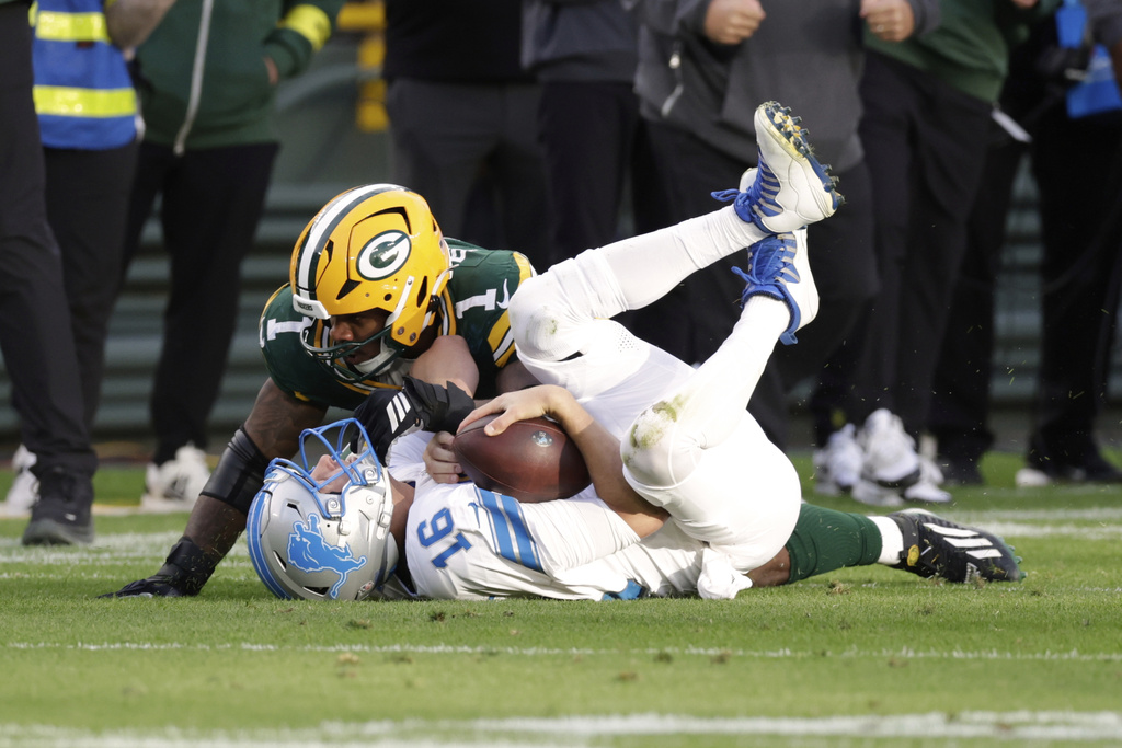 Green Bay Packers defensive end Micah Parsons (1) sacks Detroit Lions quarterback Jared Goff (16) during the second half of an NFL football game Sunday, Sept. 7, 2025, in Green Bay, Wis. (AP Photo/Matt Ludtke)