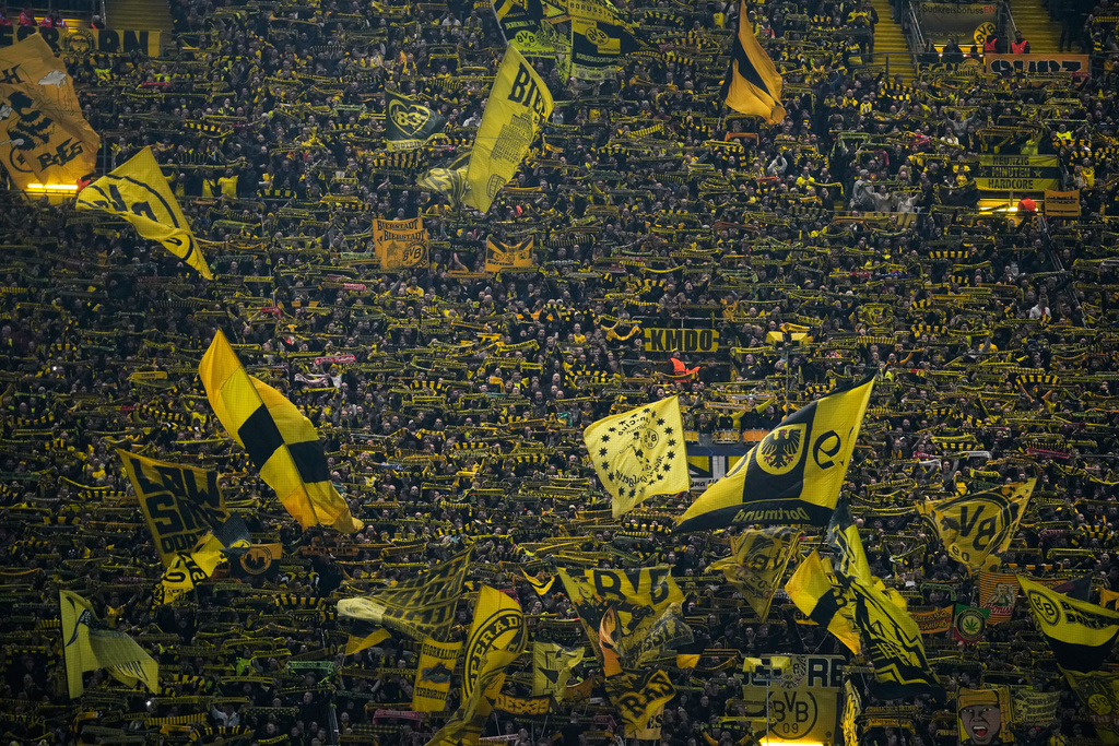 Borussia Dortmund supporters react ahead of the Champions League opening phase soccer match between Borussia Dortmund and Bodo Glimt in Dortmund, Germany, Wednesday, Dec. 10, 2025. (AP Photo/Ebrahim Noroozi)
