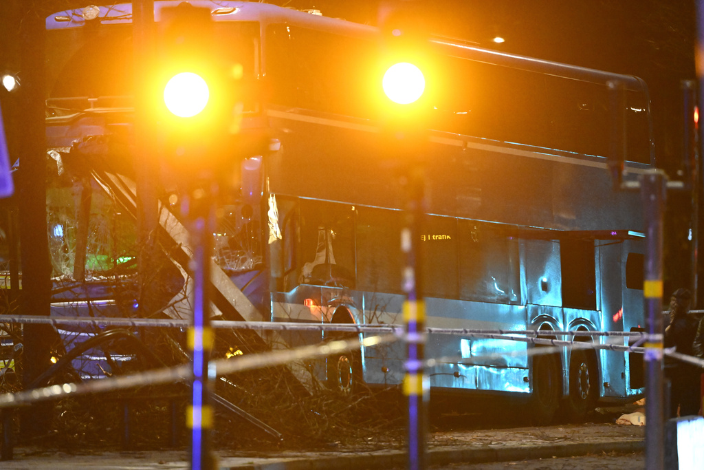 A double-decker bus crashed into a bus shelter in Stockholm on Friday, Nov. 14, 2025, causing fatalities and injuries. (Henrik Montgomery/TT News Agency via AP)