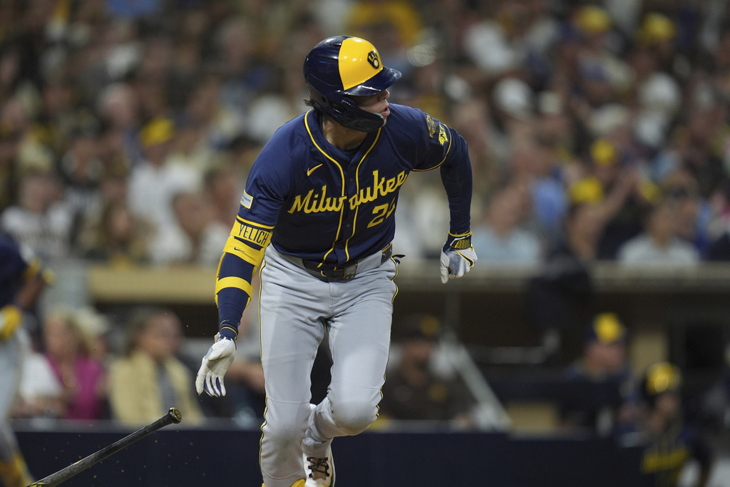 Milwaukee Brewers' Christian Yelich watches his two-RBI single during the second inning of a baseball game against the San Diego Padres Monday, Sept. 22, 2025, in San Diego. (AP Photo/Gregory Bull)