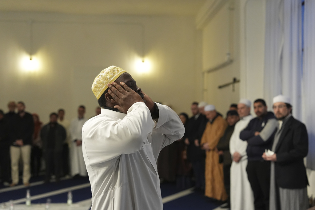 Imam Abd al-Basit calls to prayer at the Al-Wahid mosque during Ramadan in Milan, Italy, Friday, Feb. 20, 2026, as the city hosts the Winter Olympics. (AP Photo/María Teresa Hernández)