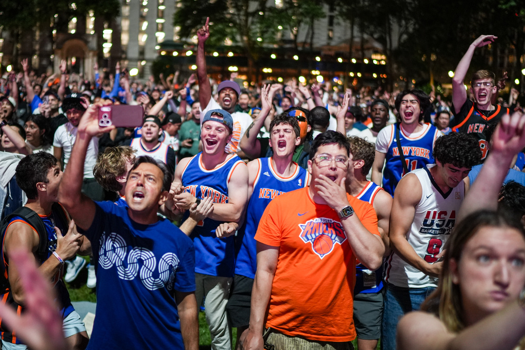 New York Knicks fans cheer at a watch party during Game 3 of the NBA Finals basketball series between the Knicks and the San Antonio Spurs, Monday, June 8, 2026, in New York. (AP Photo/Ryan Murphy)