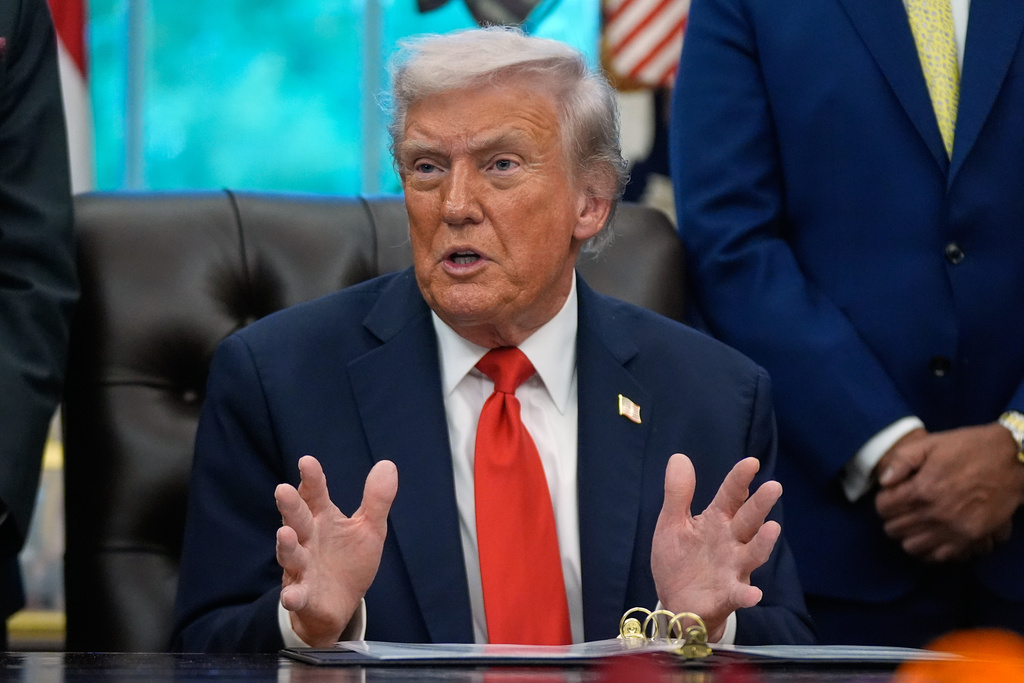 President Donald Trump answers questions from reporters during a Diwali celebration in the Oval Office at the White House, Tuesday, Oct. 21, 2025, in Washington. (AP Photo/Manuel Balce Ceneta)