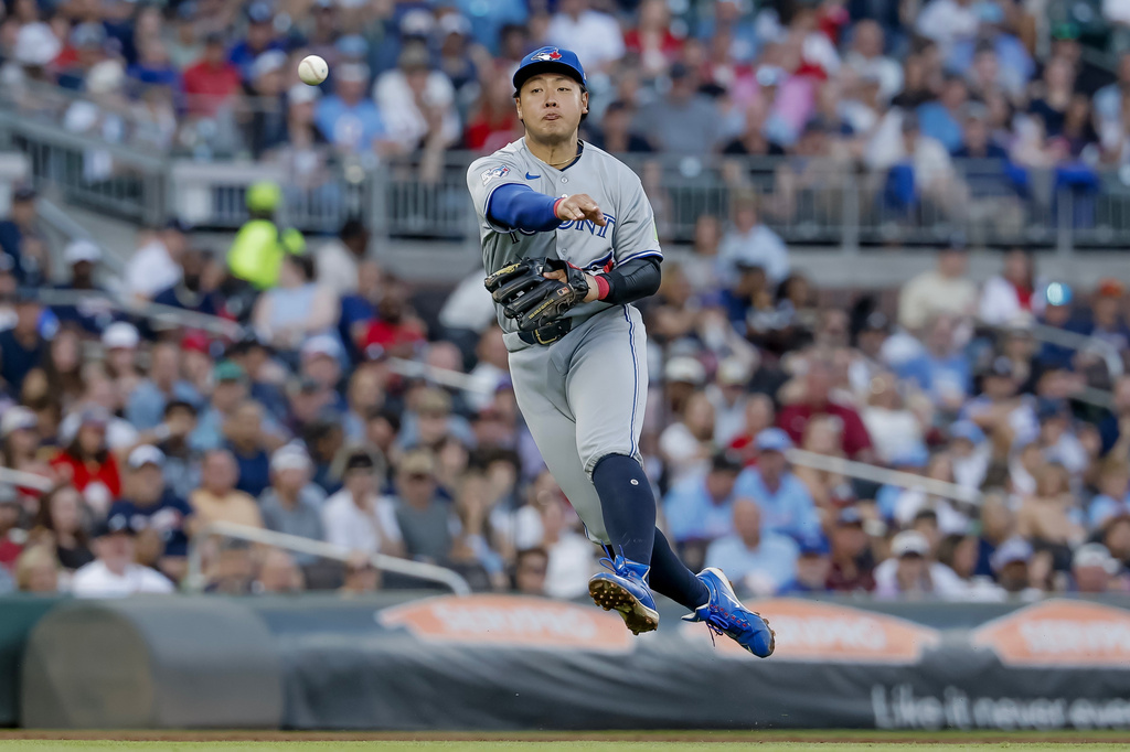 Toronto Blue Jays third baseman Kazuma Okamoto (7) fields a single hit by Atlanta Braves' Ronald Acuna Jr. during the third inning of a baseball game, Thursday, June 4, 2026, in Atlanta. (AP Photo/Erik S. Lesser)