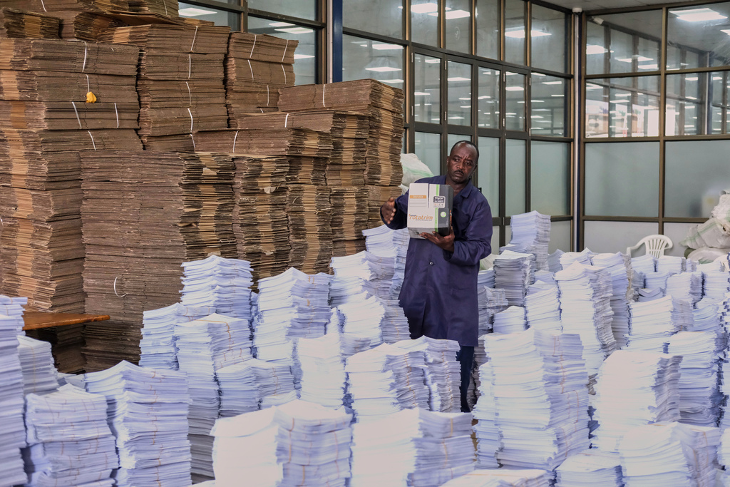 An Electoral Commission officer organises voter registrations at the Electoral Commission office in Kampala, Uganda, Wednesday, Jan. 7, 2026. (AP Photo/Hajarah Nalwadda)