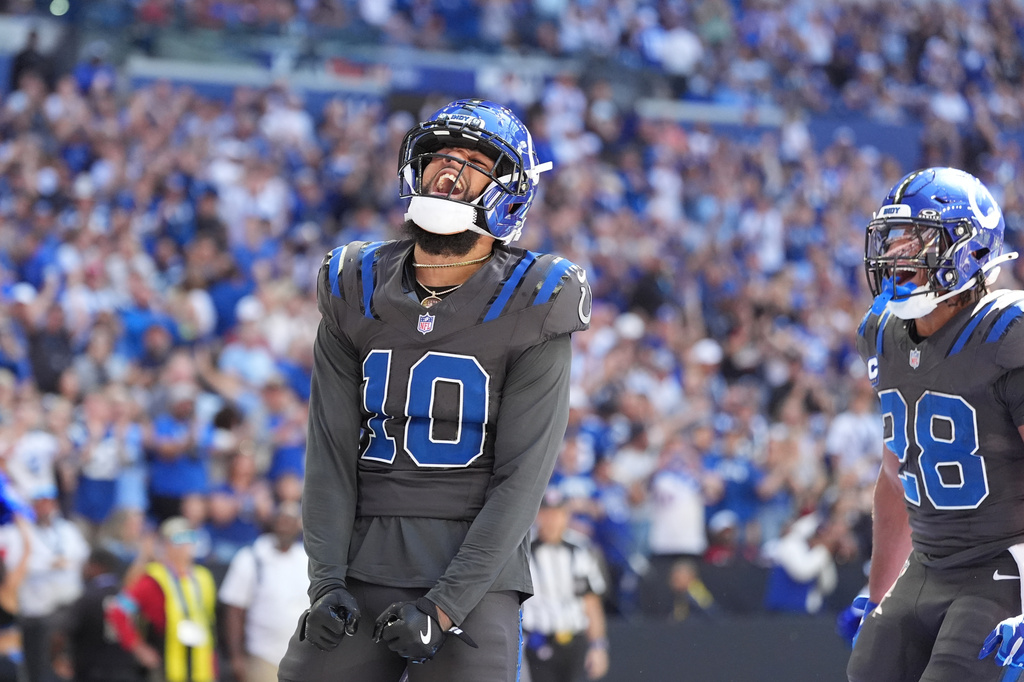 Indianapolis Colts wide receiver Keenan Allen (10) celebrates after a touchdown catch against the Houston Texans during the first half of an NFL football game, Sunday, Sept. 27, 2026, in Indianapolis. (AP Photo/Jeff Roberson)