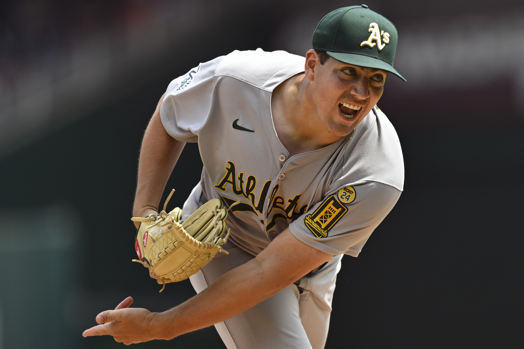 Athletics starting pitcher Jacob Lopez follows through on a pitch during the second inning of a baseball game against the Washington Nationals, Thursday, Aug. 7, 2025, in Washington. (AP Photo/John McDonnell)